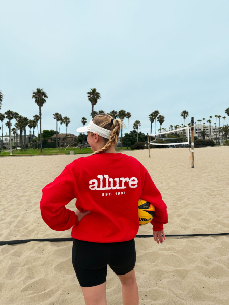 Senior art director Ingrid Fowler wearing mineral sunscreen and her Allure red sweatshirt.