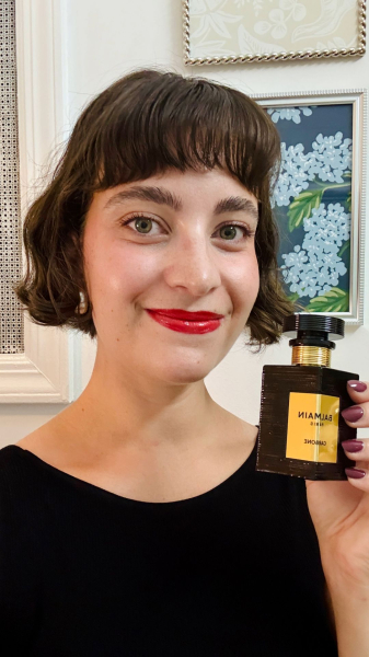 Allure senior commerce editor Sarah Felbin spraying Balmain Beauty's Carbone