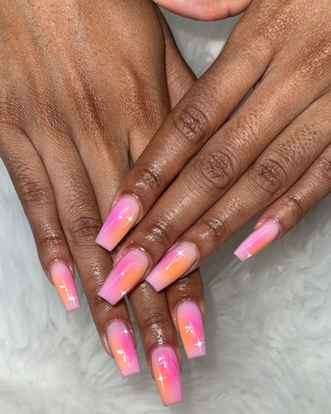 Pink and orange aura nails.