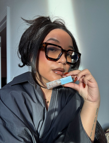 Social media manager Bianca Richards testing out a lip gloss on a night out with her girls.