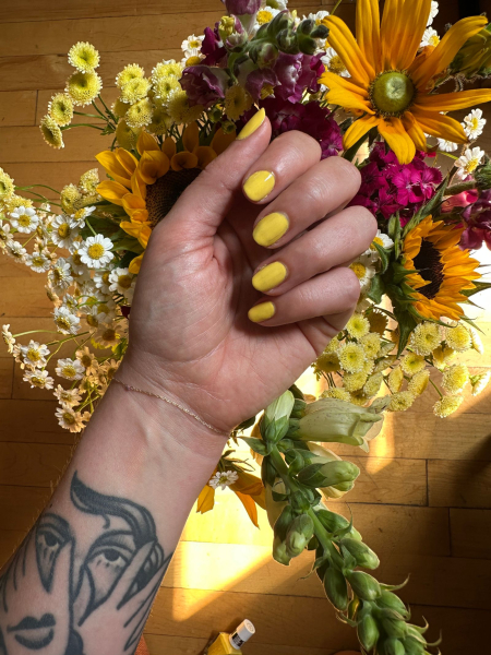 Content director Kara McGrath testing yellow nail polish.