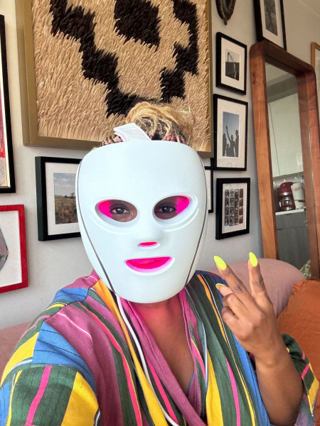 Creative director Amber Venerable wearing an LED face mask.
