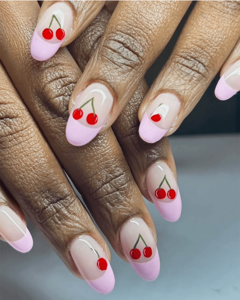 Pink and red French tip nails with cherry nail art