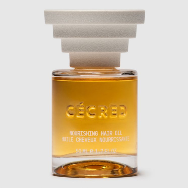 Cécred Nourishing Hair Oil bottle of hair oil with triangle steps gray cap on gray background
