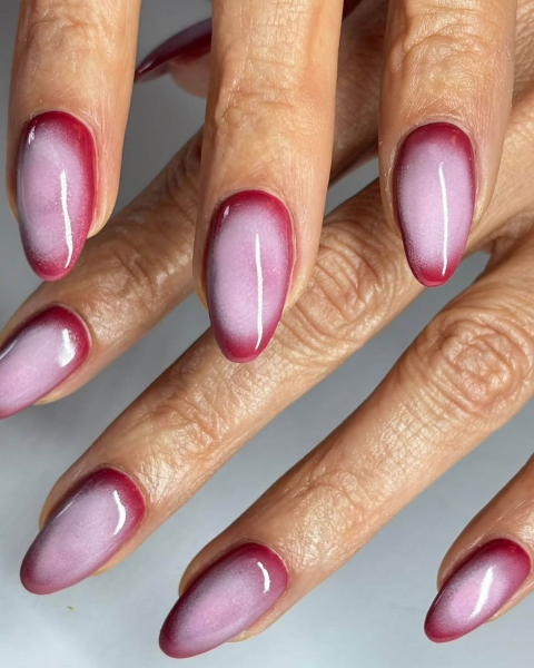 Pink and purple aura nails.