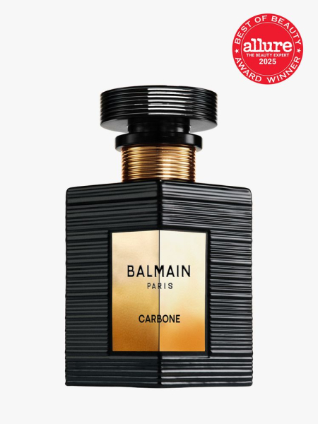 Balmain Beauty Carbone in branded black bottle with cap on light gray background with red Allure Best of Beauty seal in the top right corner